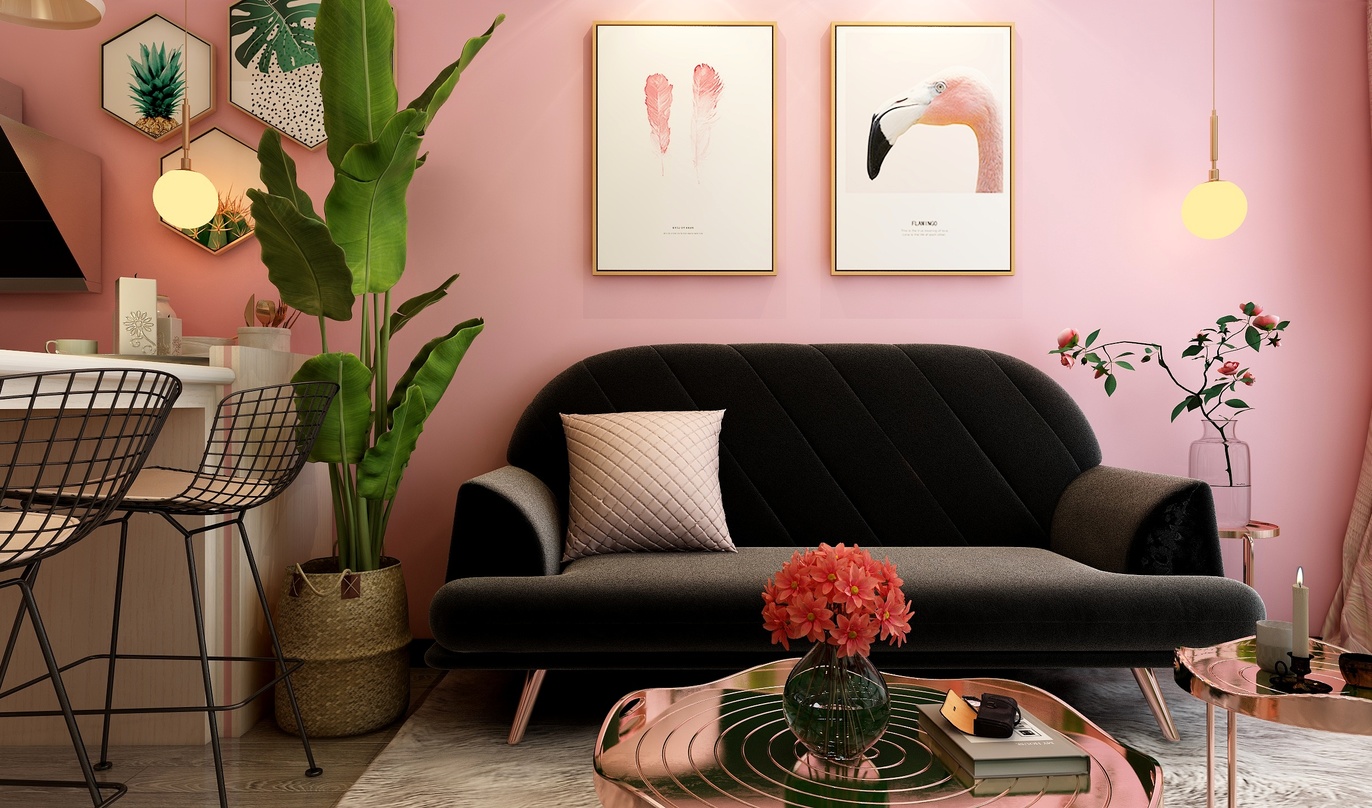 这个客厅非常时尚和美观。墙面是粉色的，给人一种温馨和舒适的感觉。在墙上挂着三幅画作，这些画作与室内装饰相得益彰，使整个空间更加高雅。黑色的沙发上放着一个粉色的抱枕，颜色搭配非常协调。茶几上有一个花瓶，瓶中插着美丽的粉色花朵，为整个空间增添了生机。角落里有一个黑色的金属椅子，看起来非常有设计感。此外，房间里的其他装饰物都相当时尚和精致，如黑色的盆栽、铜制的桌子、金色的灯等等，这些元素共同营造出一个既美观又实用的客厅空间。