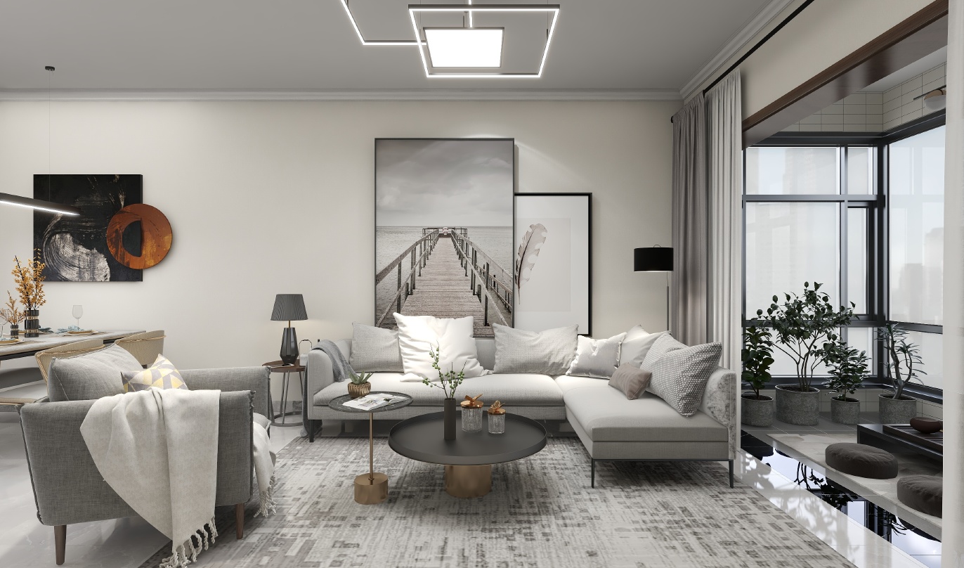 这是一间明亮的客厅，整体色调以灰色和米白色为主，给人一种简洁而温馨的感觉。地毯上印着大小不一的灰色图案，为整个空间增添了一些层次感。