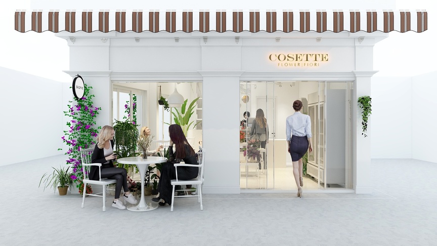 这个场景是一个商店的外景图，商店的招牌是“COSSETTE”，商店的门是玻璃门，玻璃门旁边有一个白色的logo。商店的门打开着，一个女人走进商店，后面跟着一个金发女人。坐在桌子旁边的女人带着黑色帽子，穿着黑色衣服，白色椅子上放着一个黑色的包。桌子上放着一个圆形白色桌子，桌子上放着一个插有鲜花的花瓶。花瓶的左边有一盆绿植，绿植的左边有一盆大的绿植，大的绿植后面还有一盆小一些的绿植。画面的最左边还有一盆长条形的绿植。商店的前面有一块草坪。
