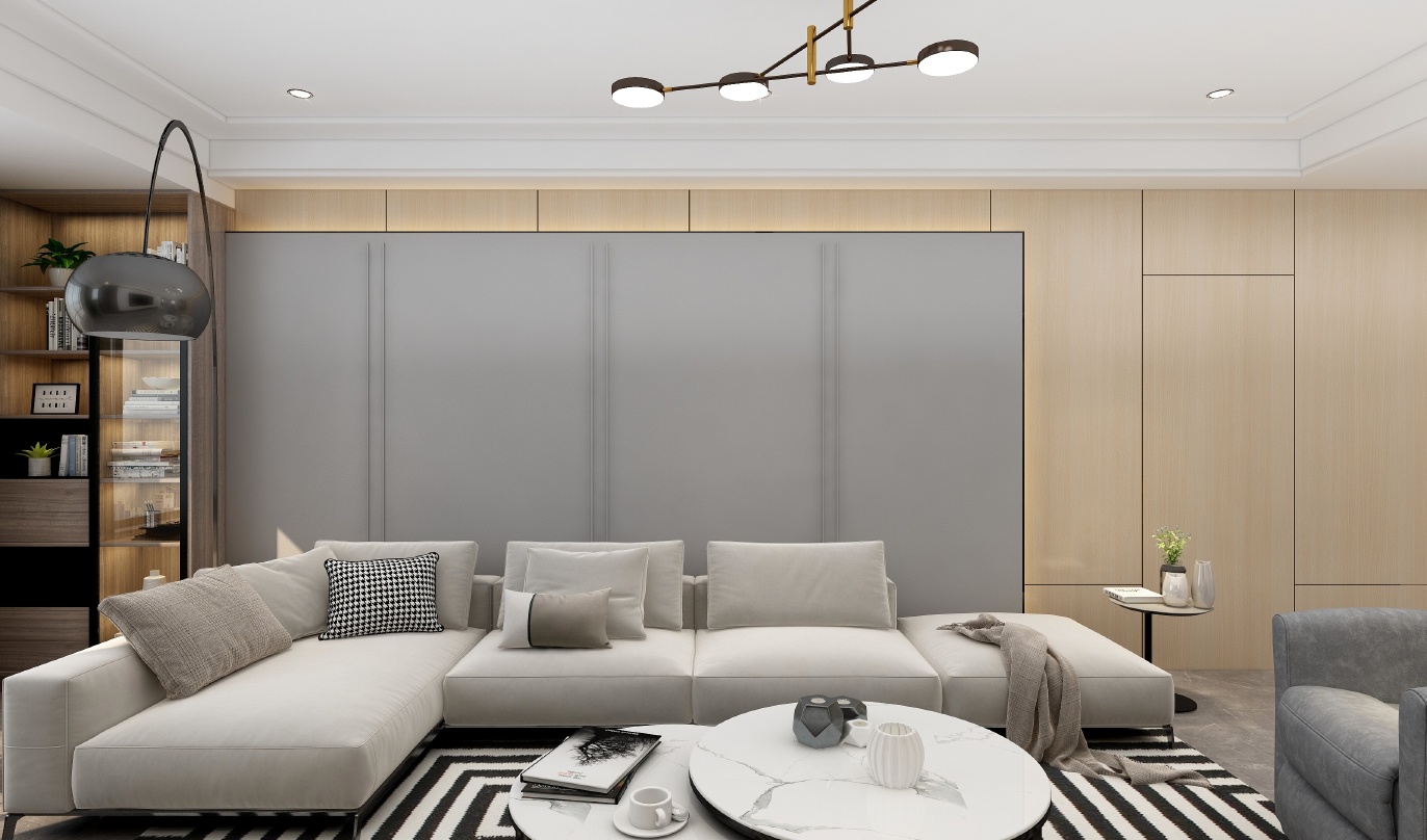 这是一个现代风格的客厅，整体色调以黑白为主，显得十分高雅。墙面是米色的，搭配深灰色的踢脚线和浅灰色的墙面板，增加了空间的层次感。吊顶使用白色，让整个空间更加宽敞明亮。