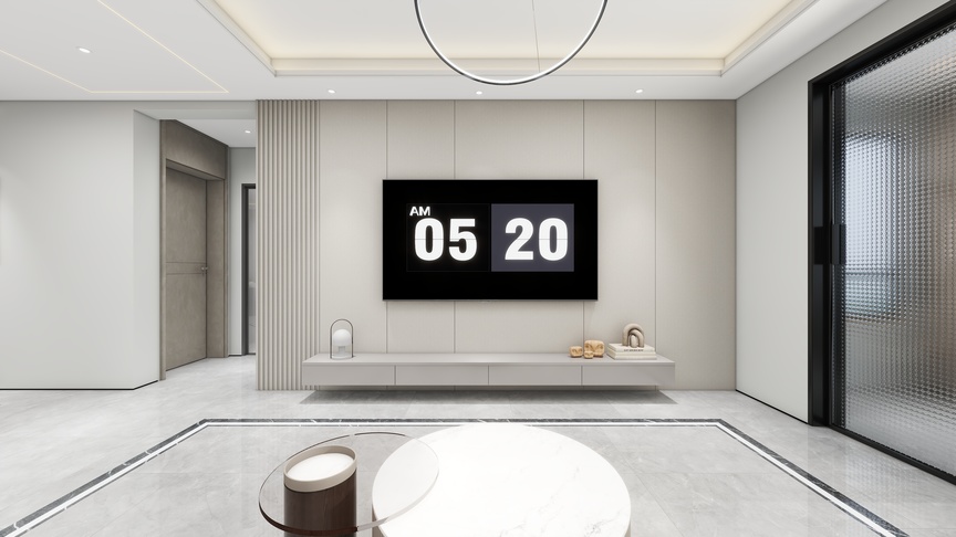 这是一个客厅的3D渲染图。客厅的墙面是米色的，地面是白色大理石纹的。在墙面的中间，有一块黑色的电视挂墙上。电视的上方有一个白色的吊灯，电视的左边有一个玻璃门，右边有一个电梯门。电视下方有一个灰色的大理石的长条，长条前方有一个和茶几同样颜色的圆形咖啡桌。墙上还挂着一幅黑色的画。